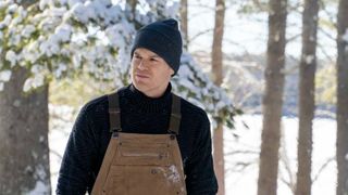 Michael C. Hall stands in the woods on Dexter New Blood