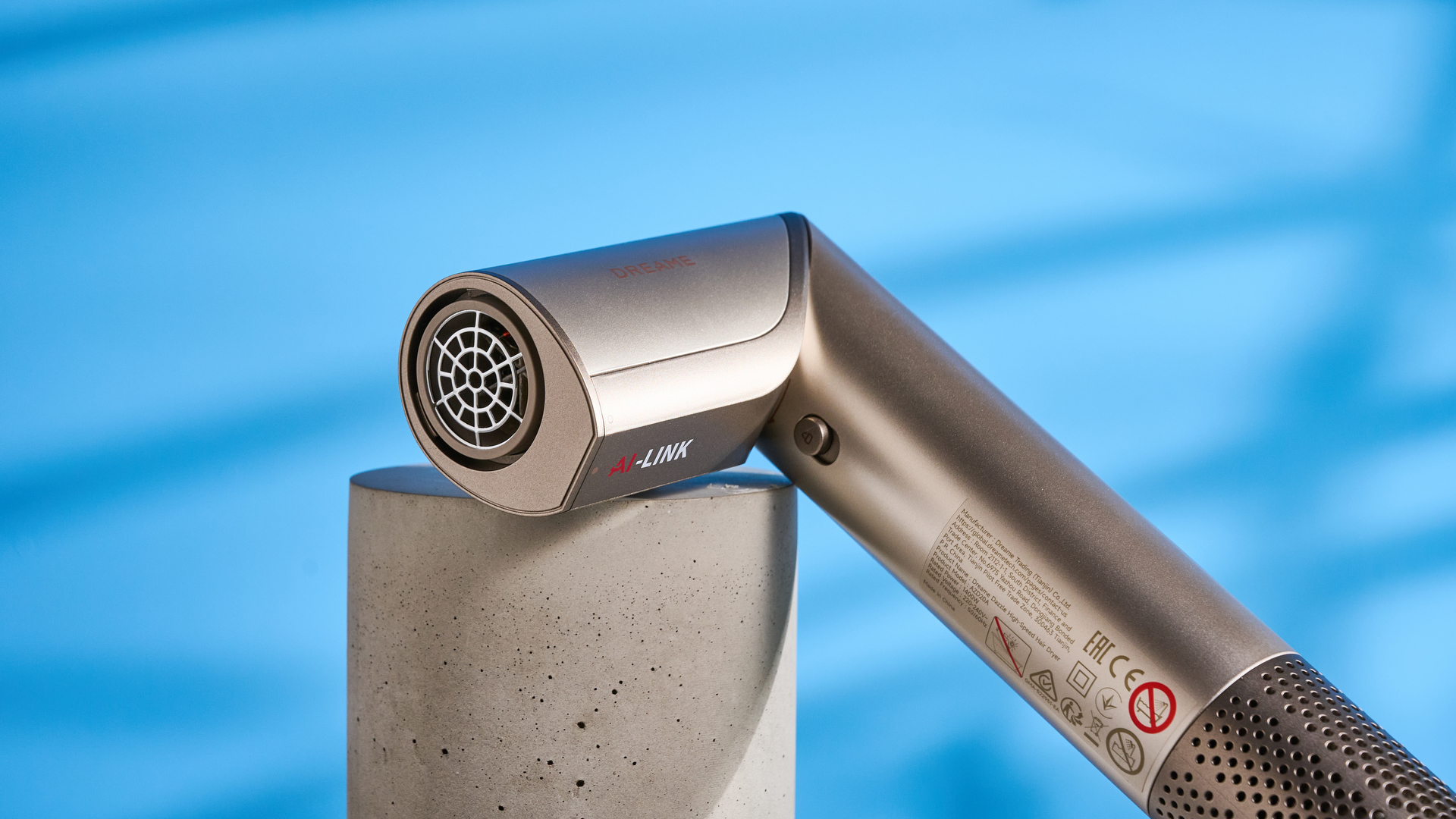 Dreame Dazzle air styler photographed in front of a blue background