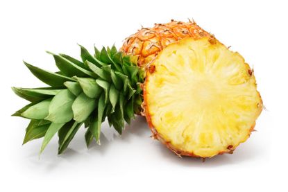 A Sliced And Whole Pineapple
