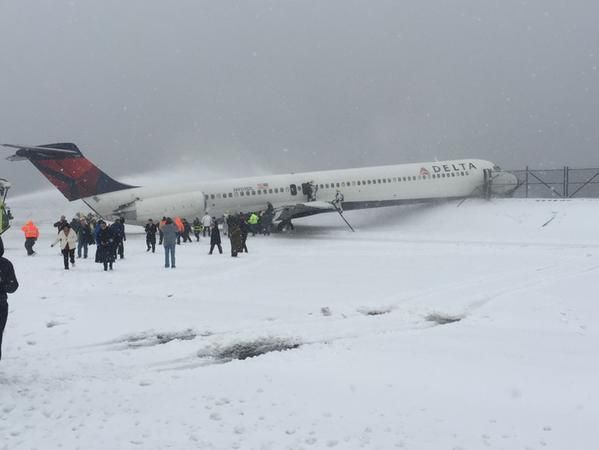 Passengers evacuate the plane