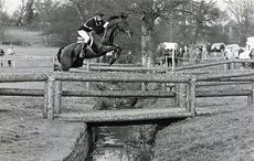 Charisma with Mark Todd over the footbridge at Badminton