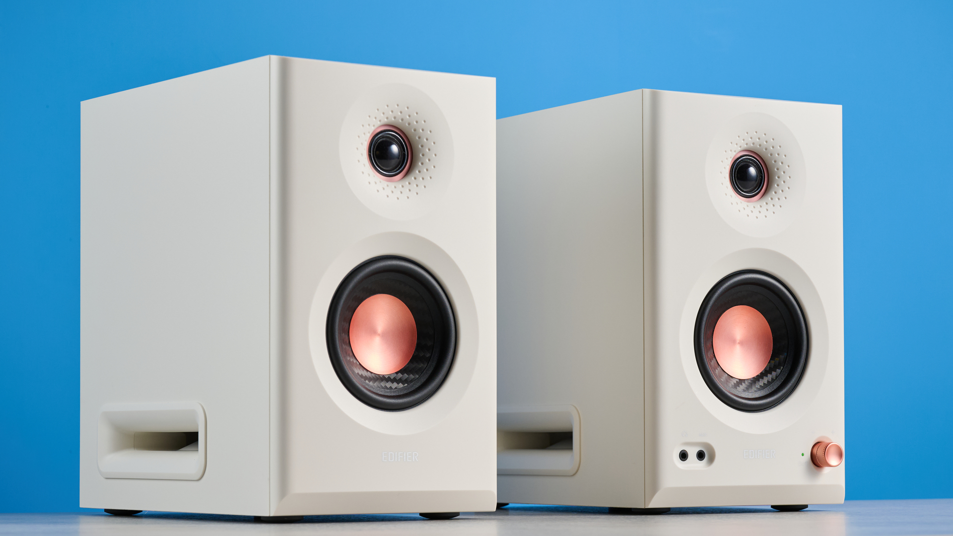 the Edifier MR5 studio monitors bookshelf speakers photographed with the blue tom's guide background