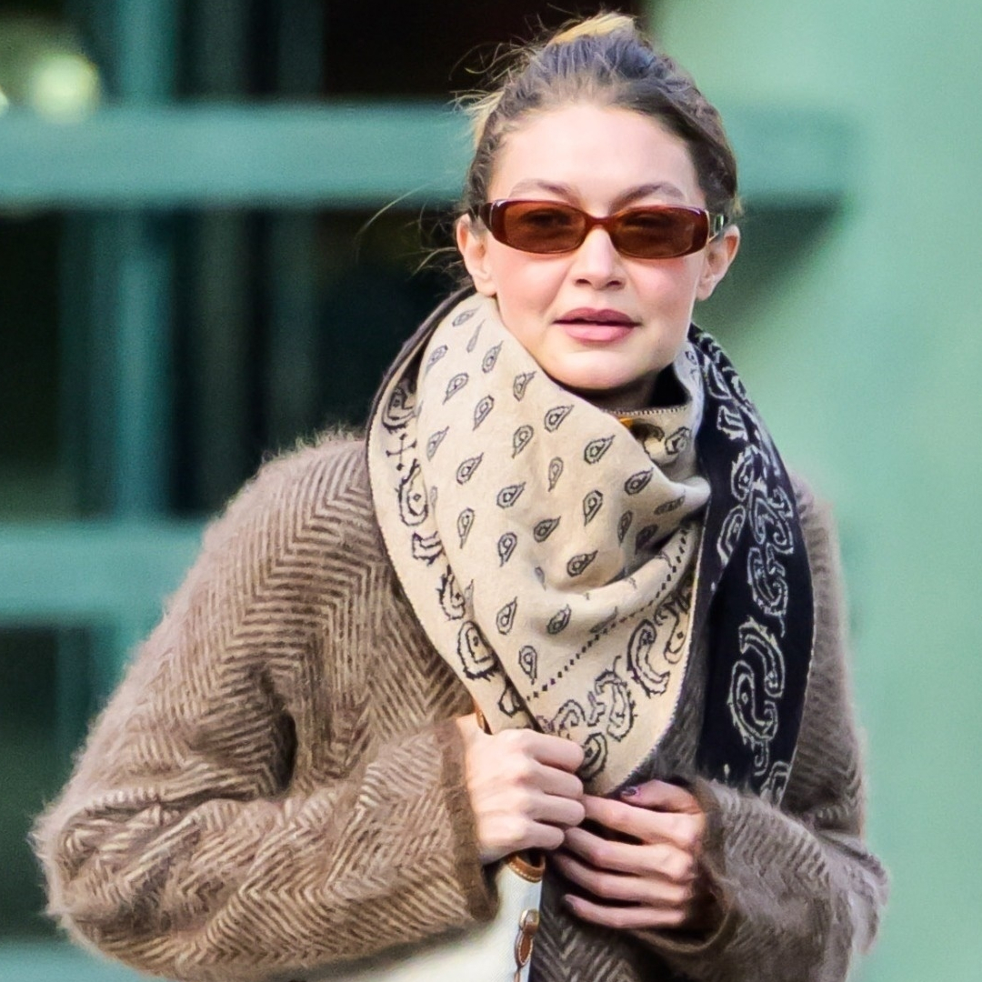 Gigi Hadid was spotted in New York wearing a wool coat, a Miu Miu bag, and fuzzy slippers
