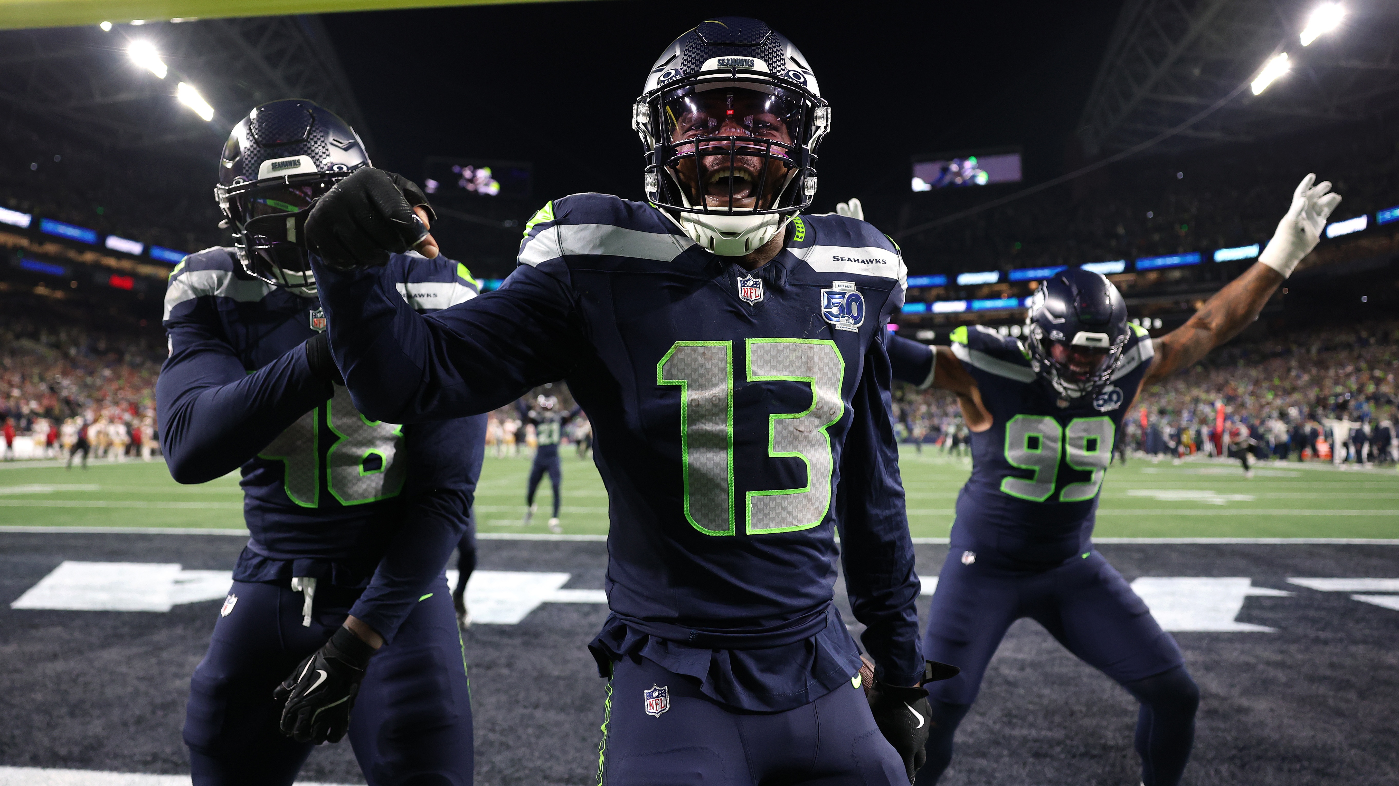 Ernest Jones IV #13 of the Seattle Seahawks celebrates an interception during the third quarter against the San Francisco 49ers in the NFC Divisional Playoff game at Lumen Field on January 17, 2026 in Seattle, Washington. 