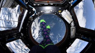 NASA astronaut Jessica Meir shows off some colorful, Hanukkah socks on the International Space Station on the first night of Hanukkah, Dec. 22, 2019.