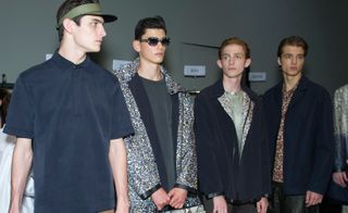 Male models wearing patterned jackets