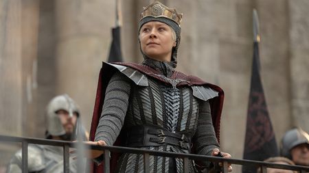 Rhaenyra standing as she holds onto a guardrail in House of the Dragon season 3 episode 8