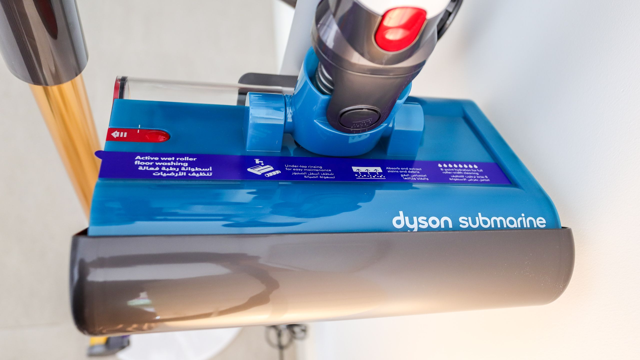 Dyson V15s Detect Submarine wet roller head in its drip tray