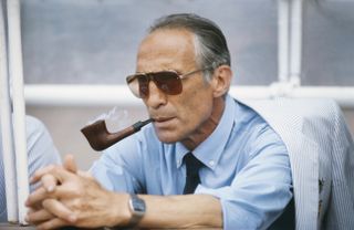 Italy coach Enzo Bearzot smokes his pipe ahead of a match at the 1982 World Cup.