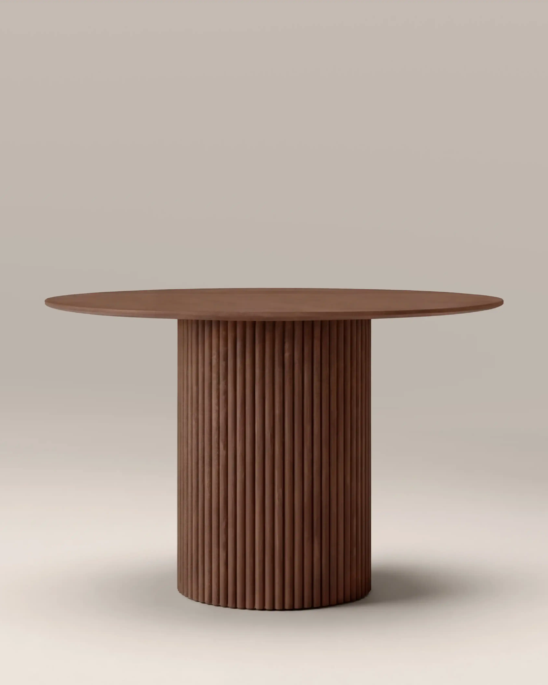 Wooden table with chunky, indented base, against pale beige background.