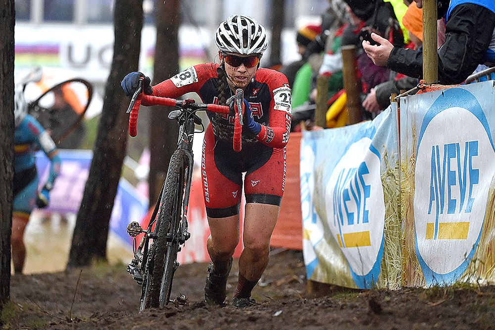 US rider Allison Arensman running through the thick mud in Zolder