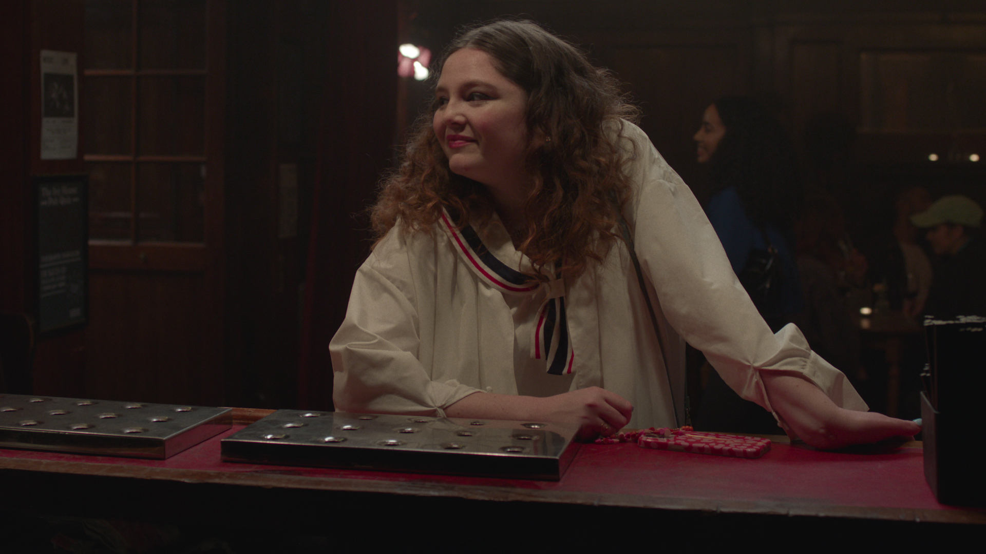 Jess from Too Much wears a sailor collar dress at the bar in the TV show