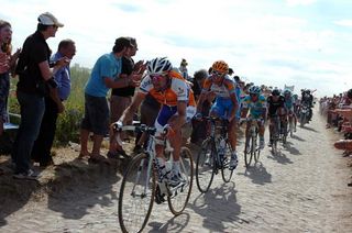 Denis Menchov (Rabobank) drives the chase group through the Haveluy section of cobbles.