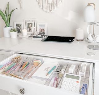 White desk with pulled out drawer
