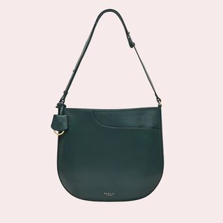 flay lay of a green handbag