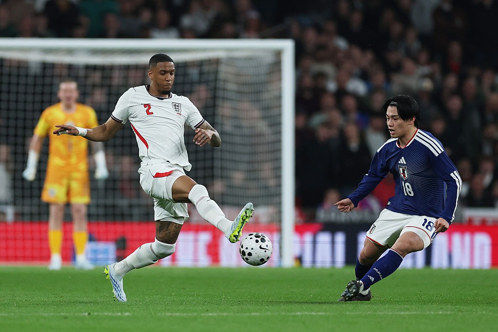 Ezri Konsa of England is put under pressure by Ayase Ueda of Japan during the international friendly match between England and Japan at Wembley Stadium on March 31, 2026 in London, England.