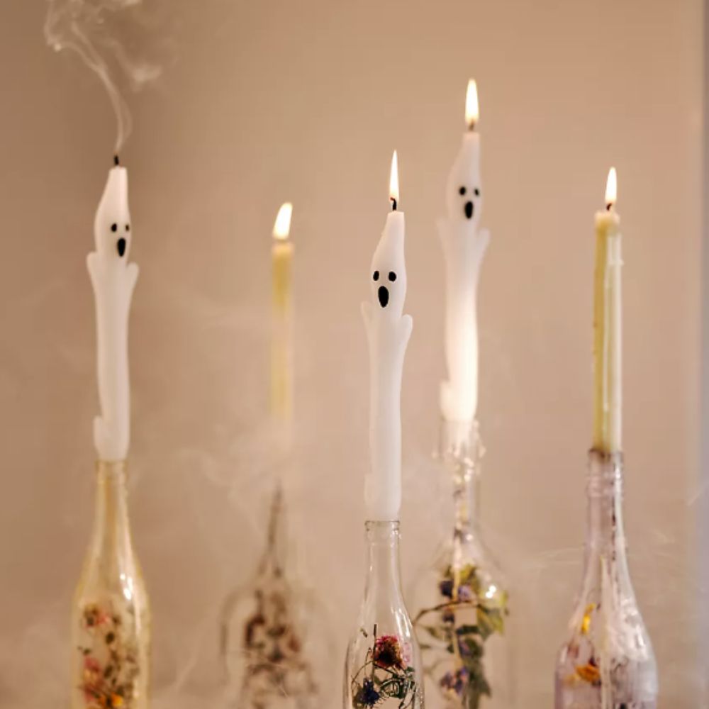 Ghost shaped taper candles in bottles