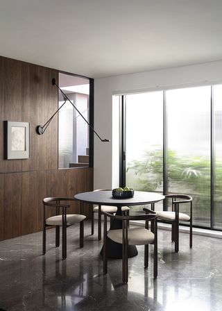 dining area in four mumbai apartments united into one