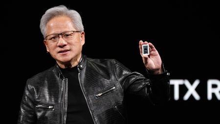 Nvidia CEO Jensen Huang holding the RTX Spark chip