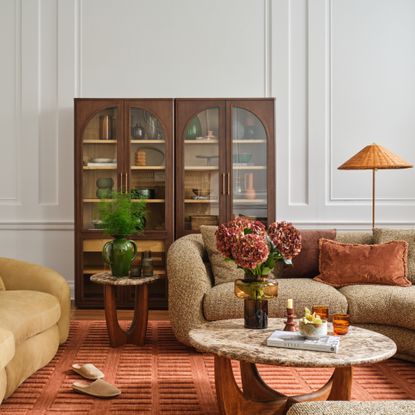 A living room featuring Castlery's Solari modular sofa in green boucle