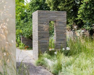 garden arch at the 'RHS Sanctuary' garden, designed by Ula Maria at RHS Hampton Court Palace Garden Festival 2019