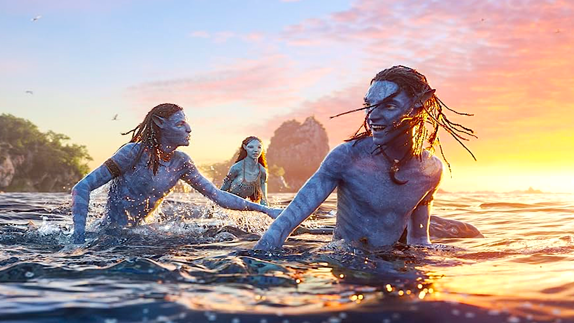 three blue-skinned aliens playing in the water