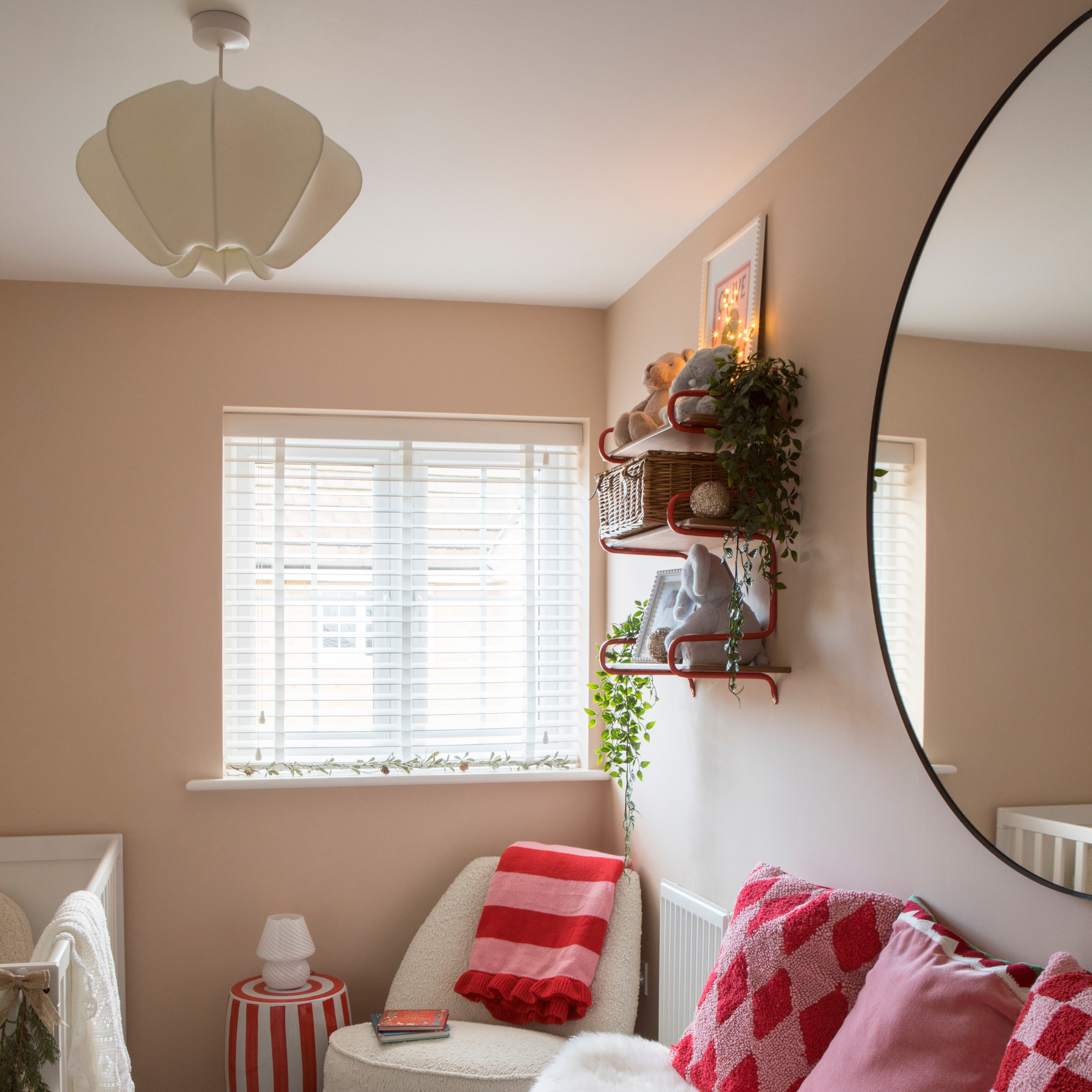 Paper lampshade in pink bedroom.