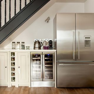 grey kitchen with fridge freezer and understair kitchen unit