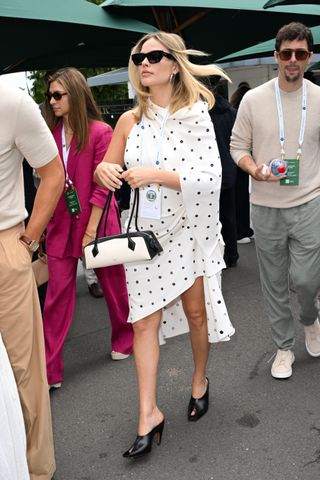 LONDON, ENGLAND - JULY 12: Margot Robbie attends day twelve of the Wimbledon Tennis Championships at the All England Lawn Tennis and Croquet Club on July 12, 2024 in London, England.