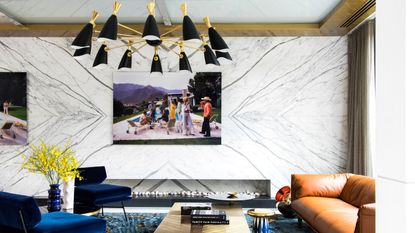 A living room with a decorative ceiling light