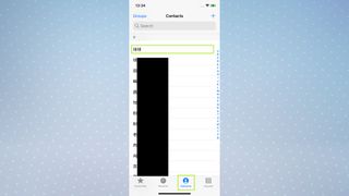 A screenshot of an iPhone screen showing the Phone app with the Contacts button highlighted