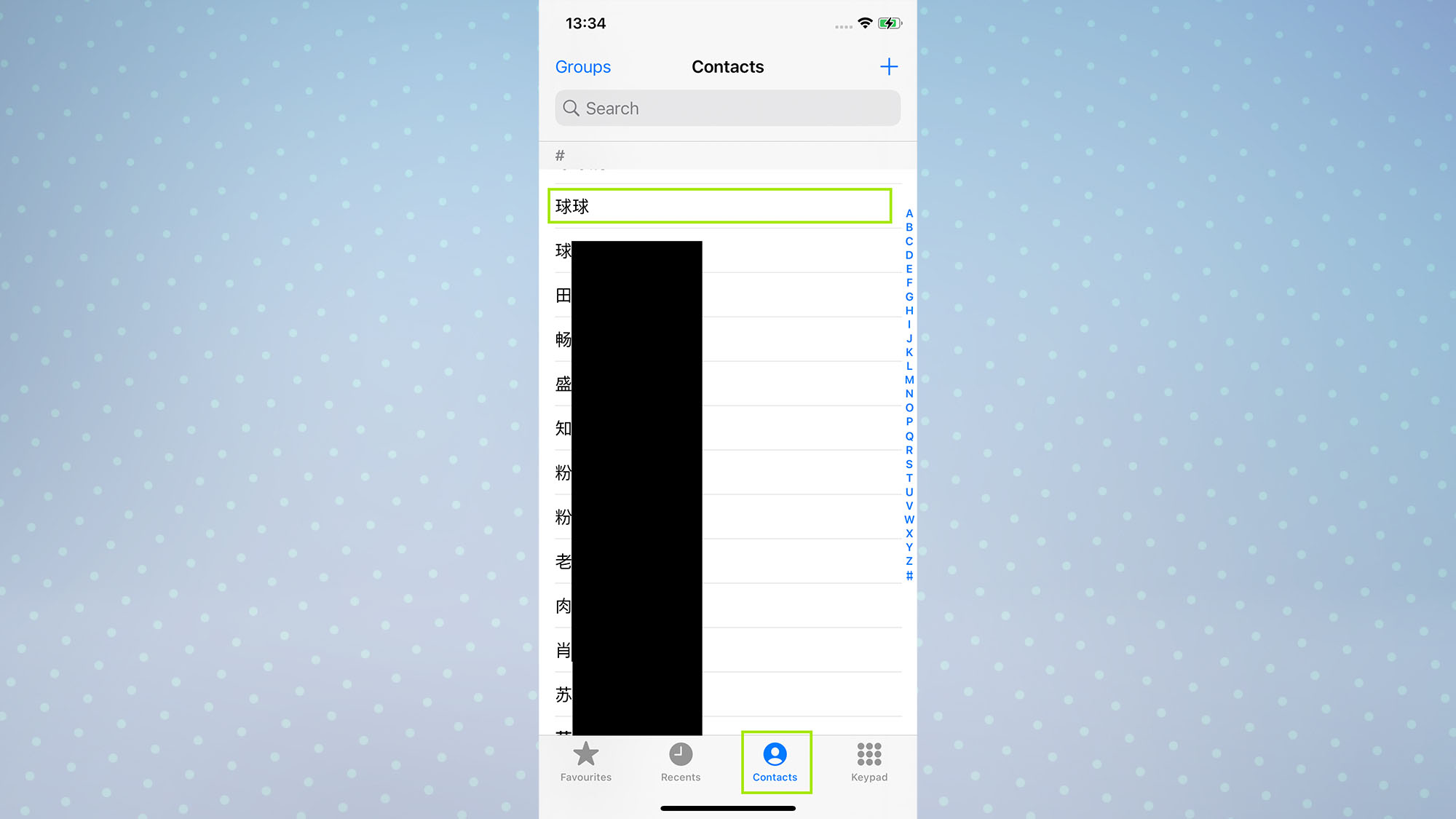 A screenshot of an iPhone screen showing the Phone app with the Contacts button highlighted