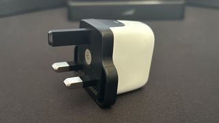 Genki Covert Dock Mini showing outlet connection on matte black background