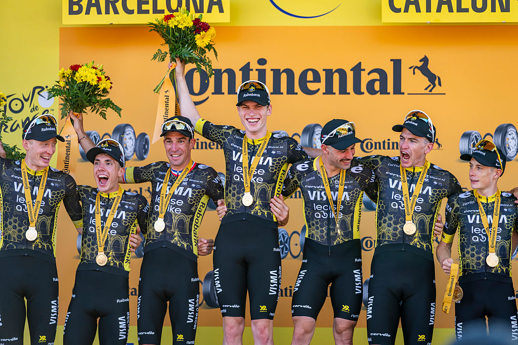BARCELONA, SPAIN - JULY 4: Jonas Vingegaard of Denmark, Edoardo Affini of Italy, Bruno Armirail of France, Victor Campenaerts of Belgium, Per Strand Hagenes of Norway, Matteo Jorgenson of United States, Sepp Kuss of United States, Davide Piganzoli of Italy and Team Visma | Lease a Bike celebrate at podium as stage winners during the 113th Tour de France 2026, Stage 1 a 19.6km team time trial stage from Barcelona to Barcelona / #UCIWT / on July 04, 2026 in Barcelona, Spain. (Photo by Alberto Gardin/Eurasia Sport Images/Getty Images)