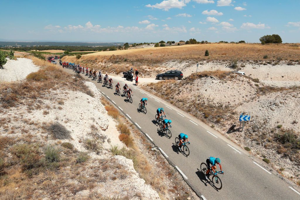 CLUNIA SPAIN AUGUST 05 A general view of Vincenzo Nibali of Italy Yuriy Natarov of Kazahkstan and Team Astana Qazaqstan and the peloton passing through a landscape during the 44th Vuelta a Burgos 2022 Stage 4 a 169km stage from Torresandino to Ciudad Romana de Clunia VueltaBurgos on August 05 2022 in Clunia Spain Photo by Gonzalo Arroyo MorenoGetty Images