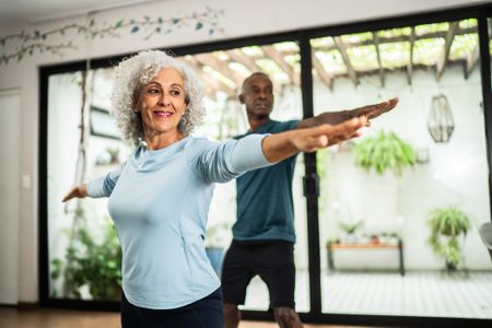 Older couple doing yoga 