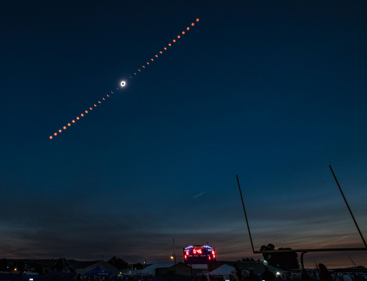 This composite image shows the progression of a total solar eclipse over Madras, Oregon, USA, on Monday, August 21, 2017