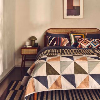 Beige bedroom with triangle blanket