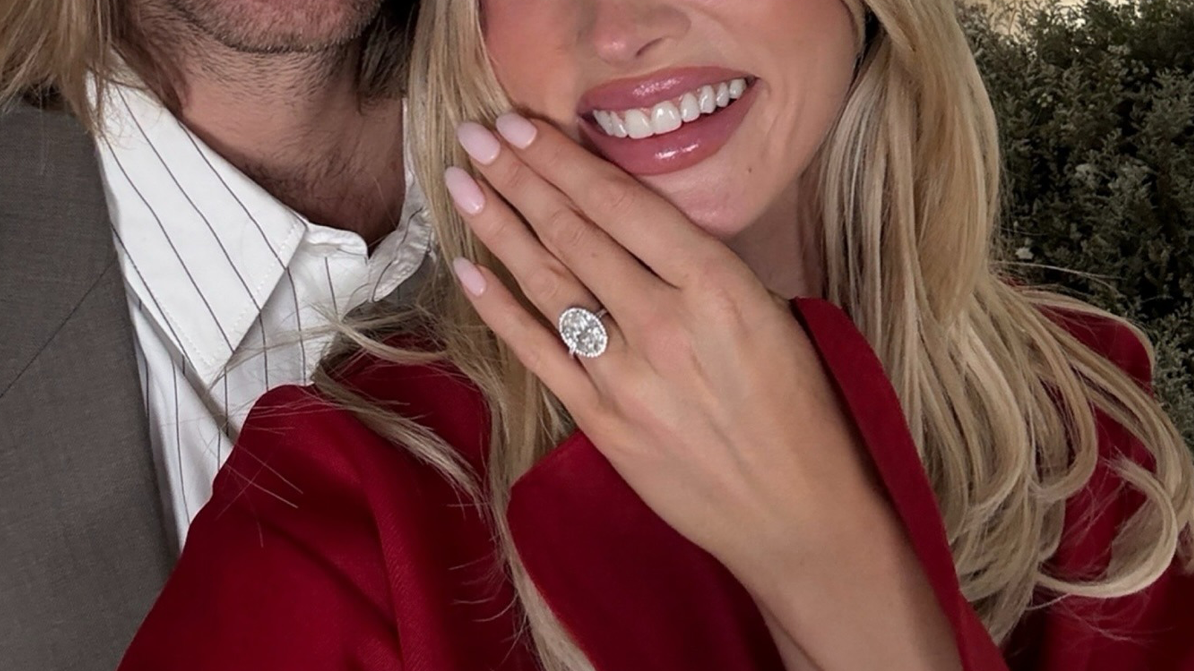 Elsa Hosk wears red dress for engagement photo shoot with engagement ring.