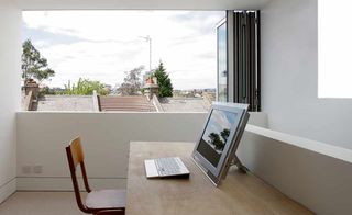 home office with bifold window