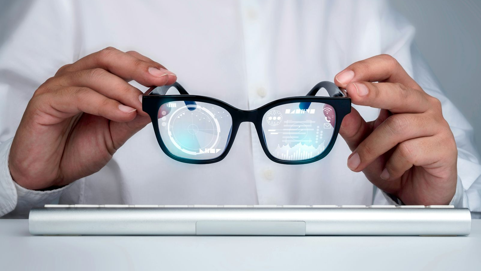 Someone holding smart glasses.