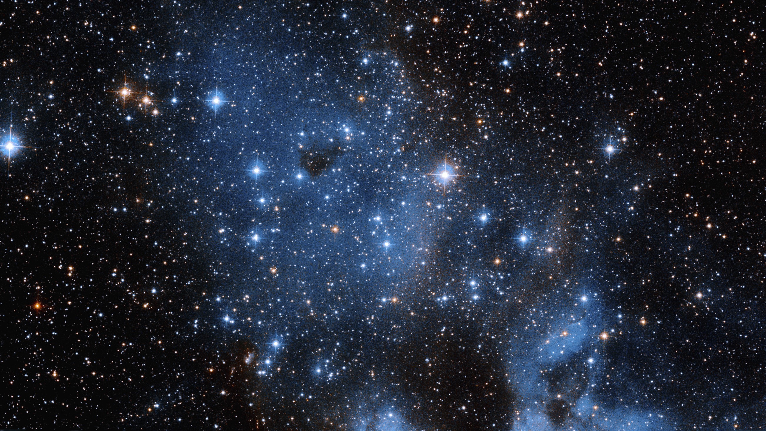 Hubble Space Telescope Spies Young Stars Amid Glowing Interstellar Gas 