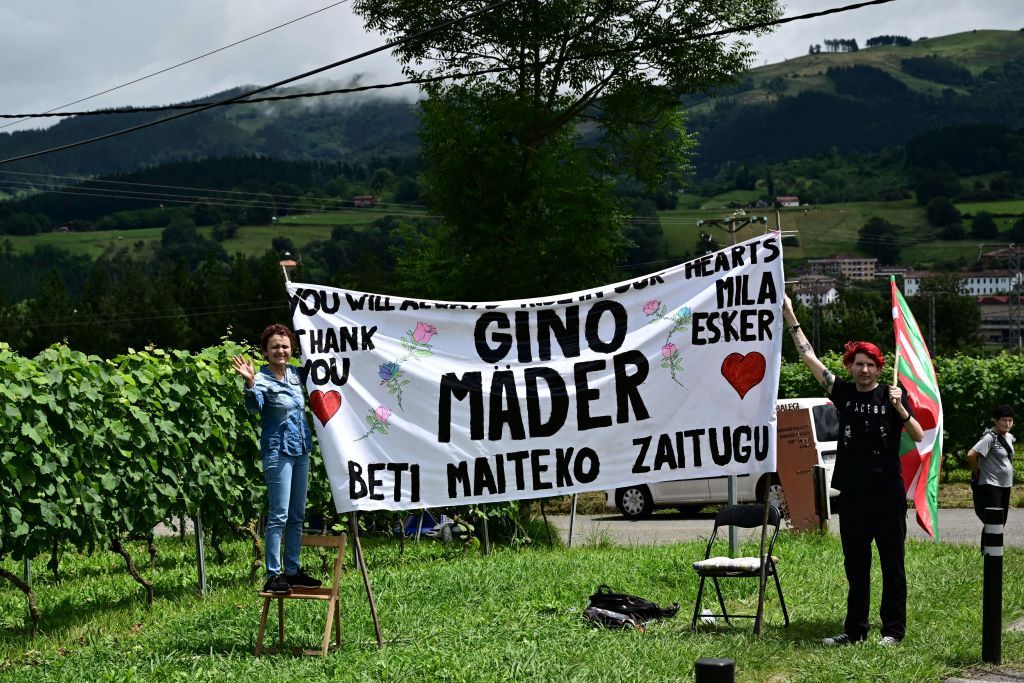 Spectators deploy a banner paying tribute to the late Swiss Cyclist Gino Mader who died in the June 2023 Tour of Switzerland after plunging into a ravine during the 2nd stage of the 110th edition of the Tour de France cycling race 2089 km between VitoriaGasteiz and San Sebastian in northern Spain on July 2 2023 Photo by Marco BERTORELLO AFP Photo by MARCO BERTORELLOAFP via Getty Images