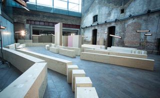 Paul Smith Catwalk at Central Saint Martins' London HQ, the venue included plywood plinths as seating surrounded by bare brick walls and exposed steel beams