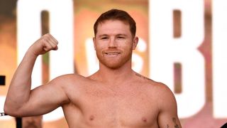 Mexican boxer Canelo Alvarez flexes his bicep ahead of the broadcast of the Canelo vs Ryder live stream