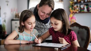 A family using one of the best drawing tablets for kids