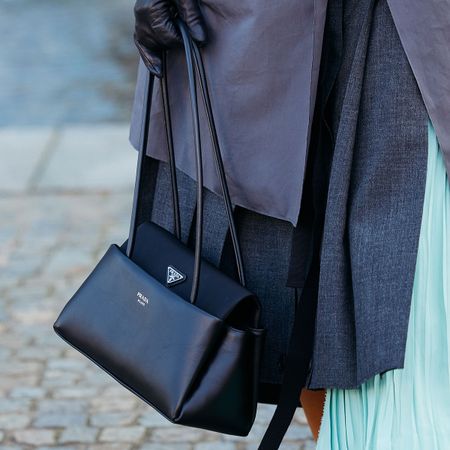 milan street style woman carrying prada passage bag