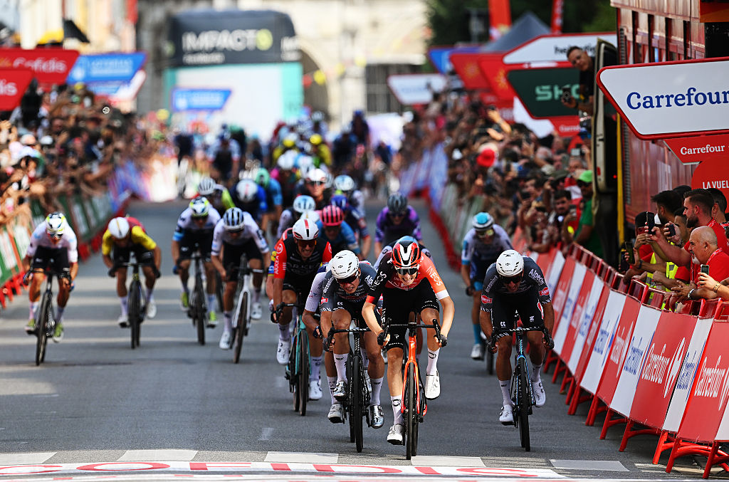 VOIRON, FRANCE - AUGUST 26: (L-R) Jasper Philipsen of Belgium and Team Alpecin - Deceuninck, stage winner Ben Turner of Great Britain and Team INEOS Grenadiers and Edward Planckaert of Belgium and Team Alpecin - Deceuninck sprint at finish line during the La Vuelta - 80th Tour of Spain 2025, Stage 4 a 206.7km stage from Susa to Voiron / #UCIWT / on August 26, 2025 in Voiron, France. (Photo by Dario Belingheri/Getty Images)