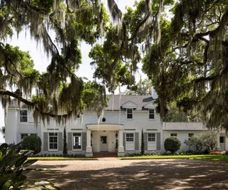 house exterior with porch and trees