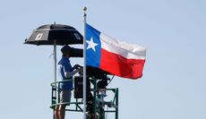 The Texas flag flutters in the wind